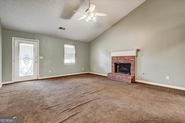 unfurnished living room with a fireplace, high vaulted ceiling, ceiling fan, and carpet flooring