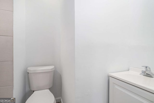 bathroom with toilet and vanity