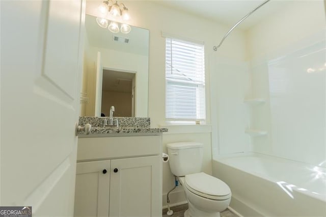 full bathroom with toilet, vanity, and shower / bath combination