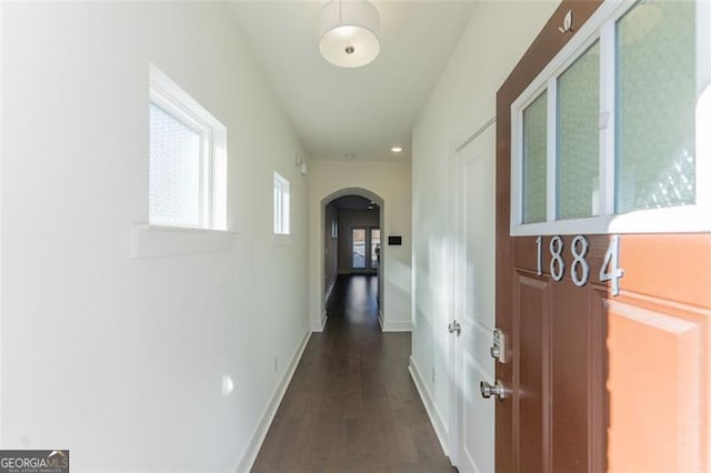 corridor featuring dark hardwood / wood-style flooring