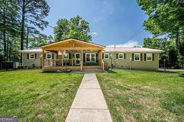 view of front of home with a front yard and covered porch