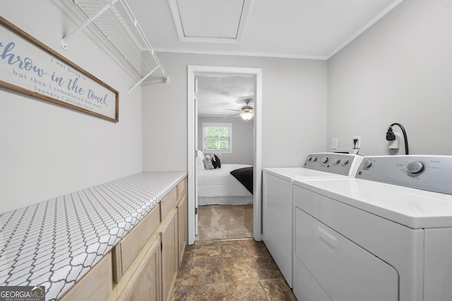 washroom featuring washing machine and clothes dryer, ceiling fan, and cabinets