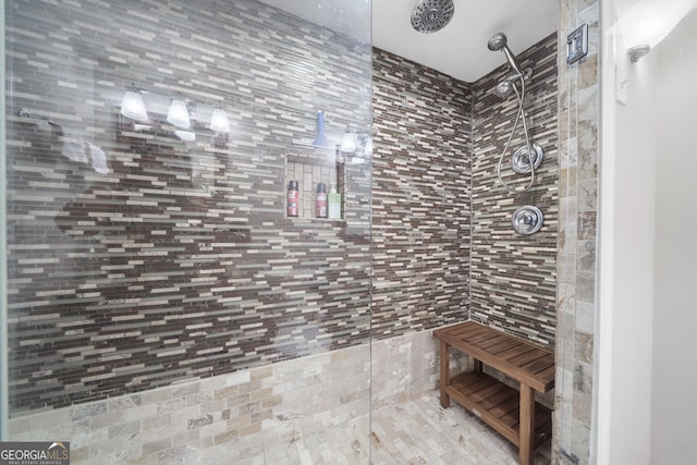 bathroom featuring a tile shower