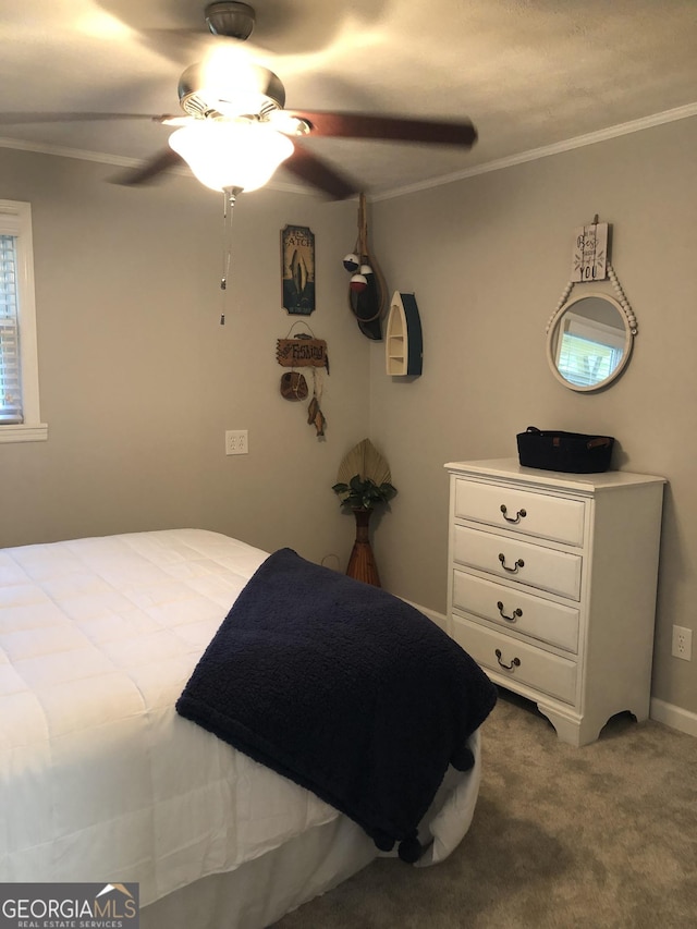 bedroom featuring carpet flooring, ceiling fan, and ornamental molding