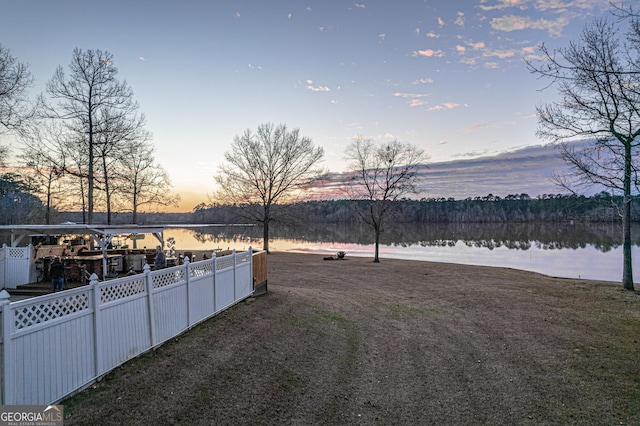 yard at dusk with a water view