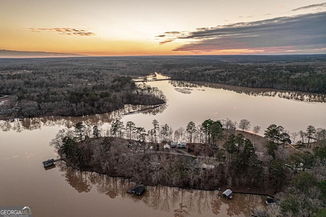 aerial view at dusk with a water view