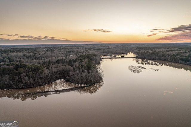 aerial view at dusk with a water view