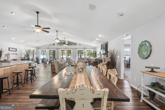 dining area featuring sink, lofted ceiling, ceiling fan, and dark hardwood / wood-style floors