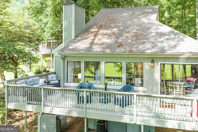 back of property featuring an outdoor hangout area, a deck, and central air condition unit