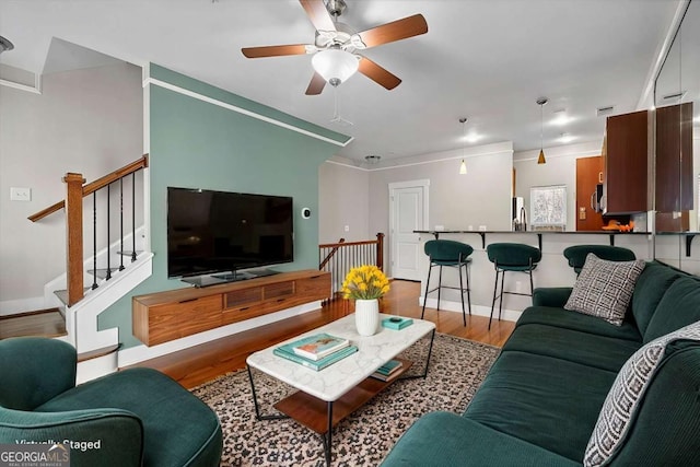 living room with ceiling fan and hardwood / wood-style floors