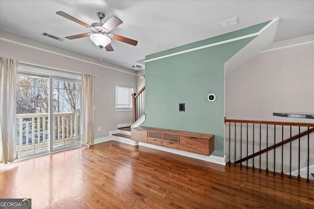 interior space with ceiling fan and hardwood / wood-style floors