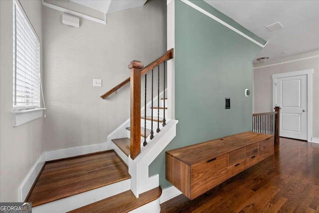 staircase featuring hardwood / wood-style floors