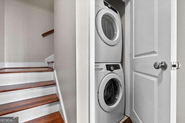 laundry room featuring stacked washer and clothes dryer