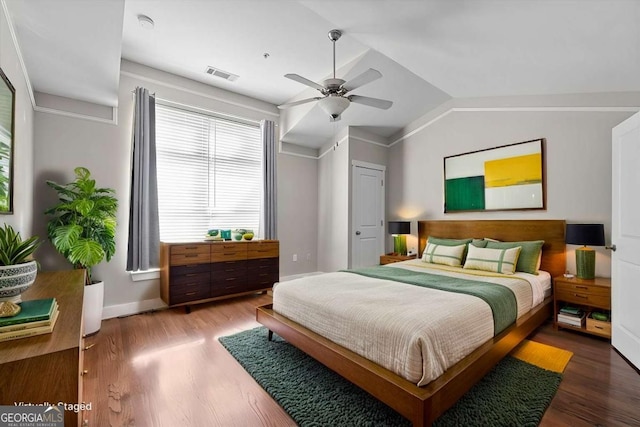 bedroom featuring lofted ceiling, ceiling fan, and hardwood / wood-style flooring