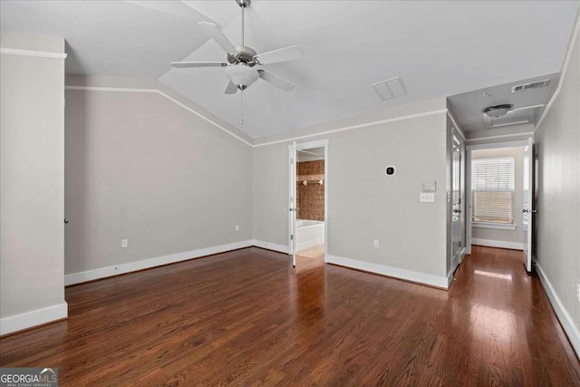 unfurnished living room featuring lofted ceiling, ceiling fan, ornamental molding, and dark hardwood / wood-style floors