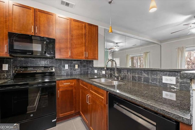 kitchen featuring sink, ceiling fan, dark stone countertops, and black appliances