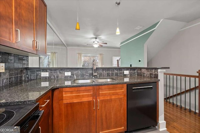 kitchen featuring sink, dishwasher, ceiling fan, dark stone countertops, and tasteful backsplash