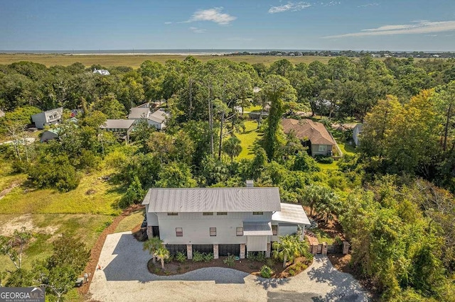 drone / aerial view featuring a view of trees