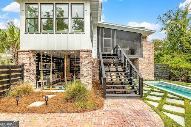 doorway to property featuring a fenced in pool