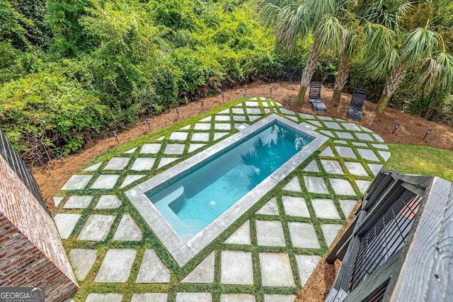 view of swimming pool with a patio area