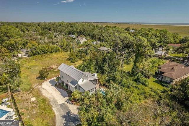 aerial view featuring a wooded view