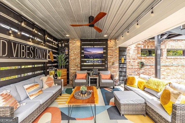 interior space featuring an outdoor hangout area and ceiling fan