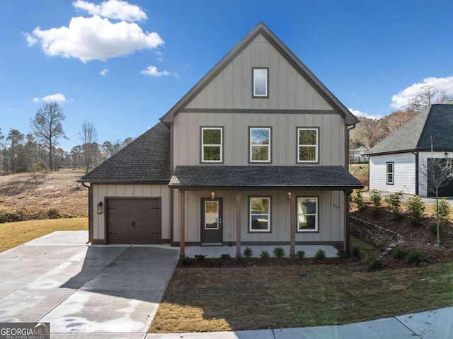 view of front of property featuring a garage and a porch