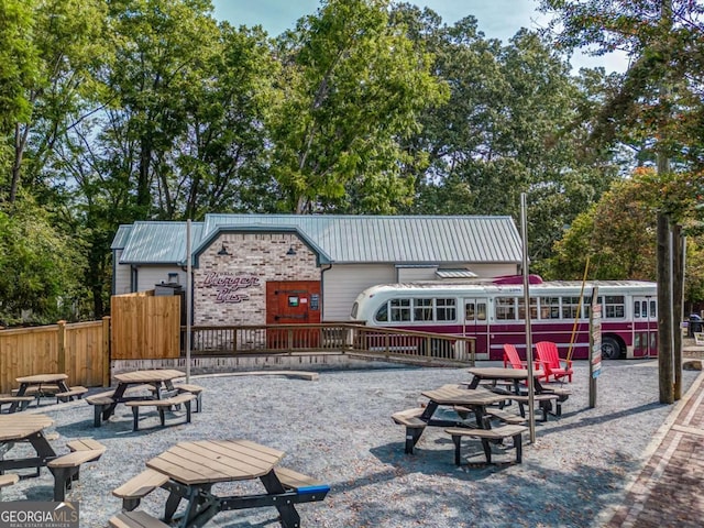 view of home's community featuring a fire pit