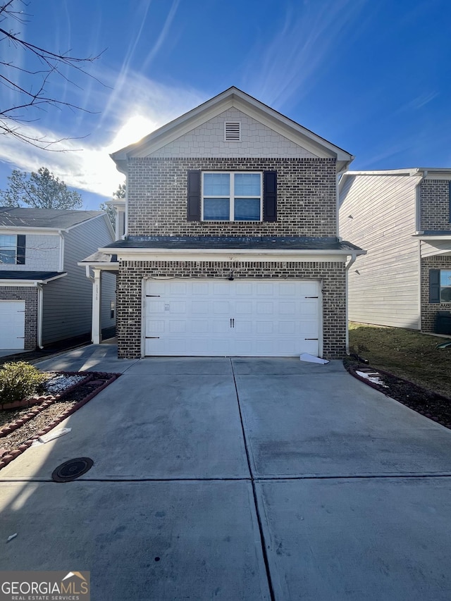 front of property featuring a garage