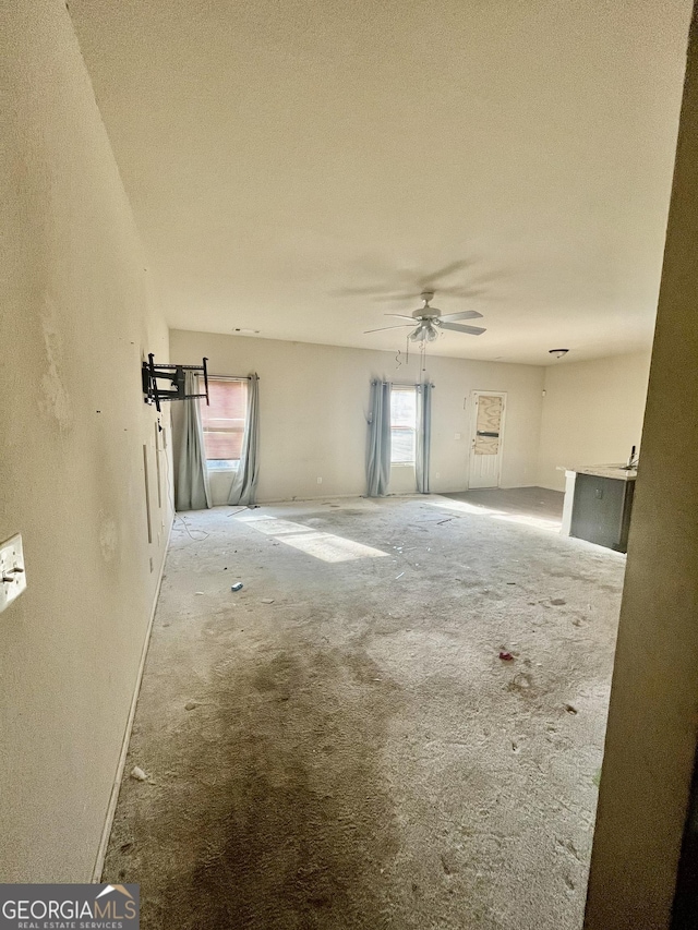 spare room featuring a textured ceiling and ceiling fan