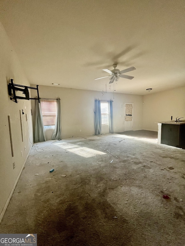 empty room with sink, a textured ceiling, and ceiling fan