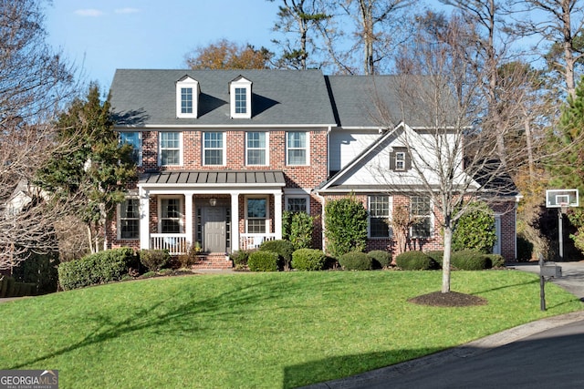 view of front of property with a porch and a front yard