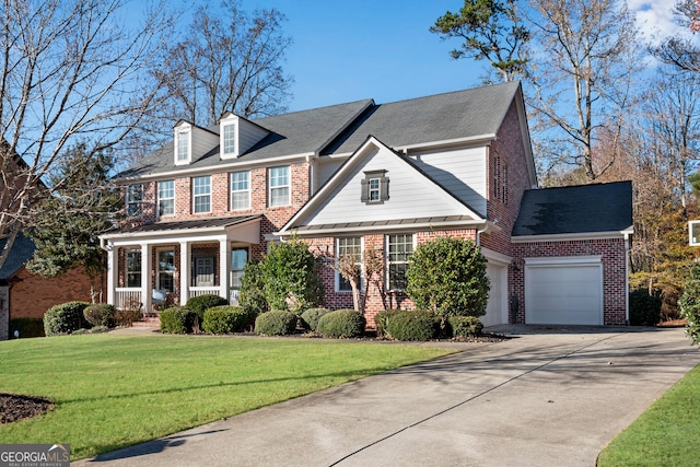 view of front of home featuring a garage, a porch, and a front lawn