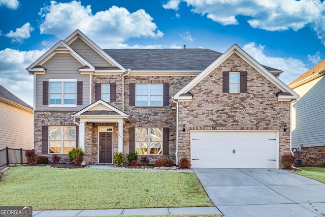 craftsman-style house featuring a front yard and a garage