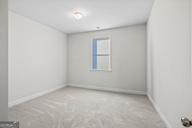 spare room featuring carpet flooring