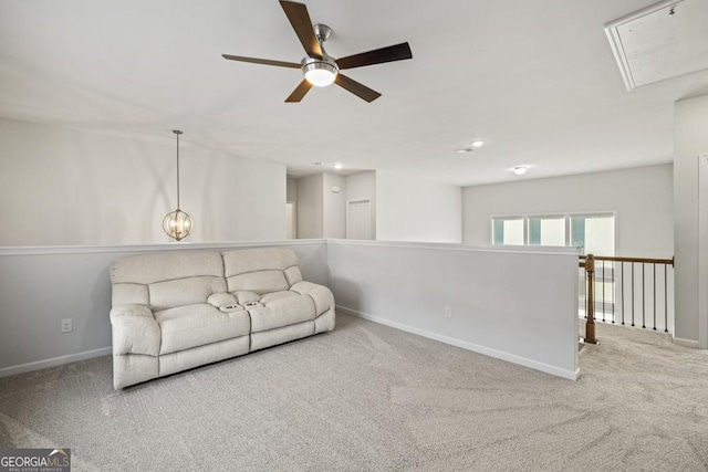 carpeted living room featuring ceiling fan