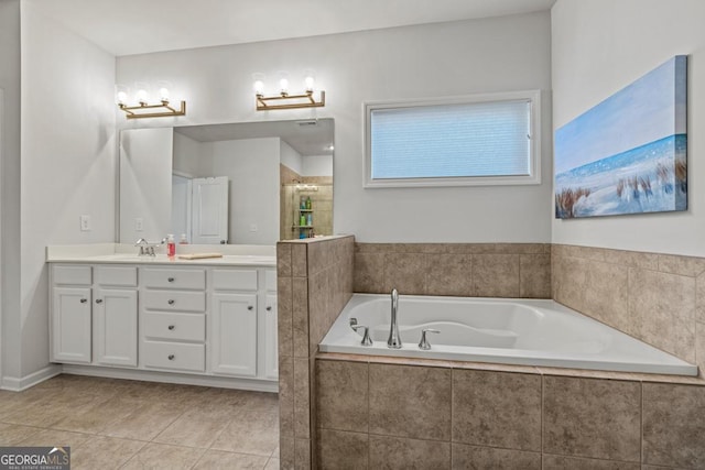 bathroom with tile patterned flooring, separate shower and tub, and vanity