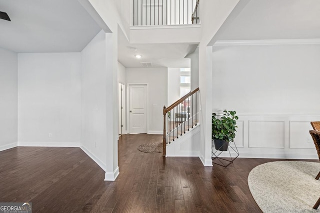 foyer entrance featuring dark hardwood / wood-style floors