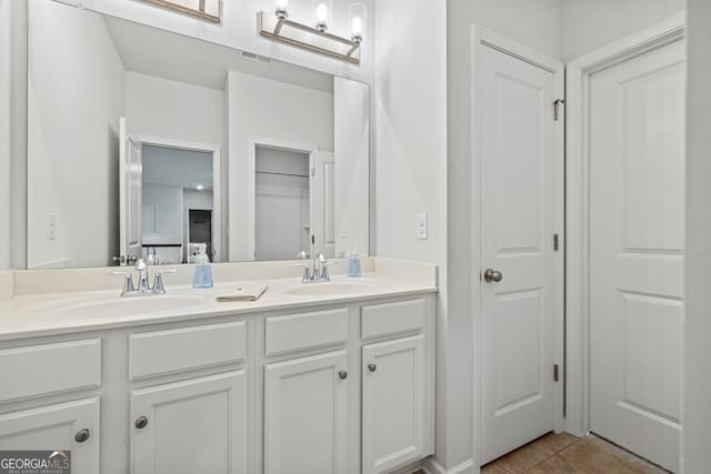 bathroom with vanity and tile patterned flooring