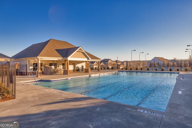 view of swimming pool with a patio area