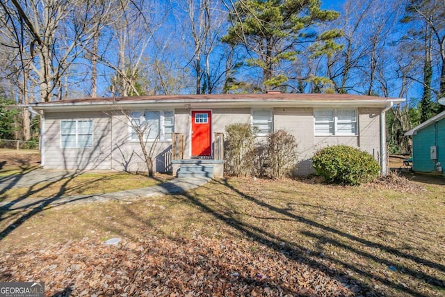 single story home featuring a front yard