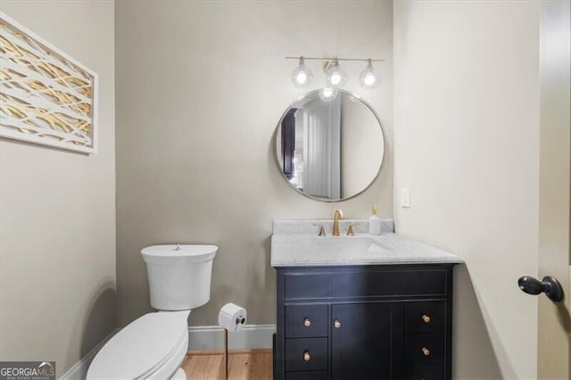 bathroom with toilet and vanity