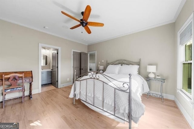 bedroom featuring ensuite bath, ceiling fan, light hardwood / wood-style floors, and crown molding