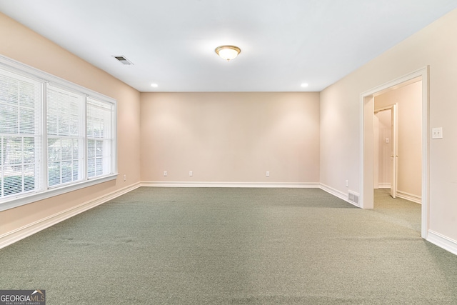 unfurnished room featuring carpet floors