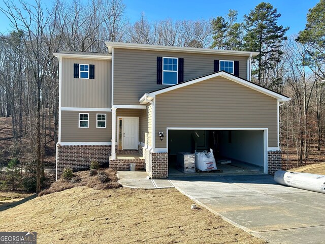 view of front of property with a front lawn and a garage