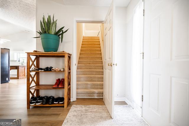 stairway featuring hardwood / wood-style floors