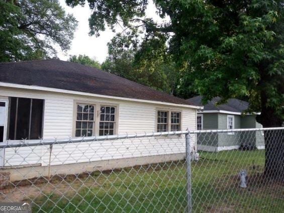 view of property exterior featuring a yard