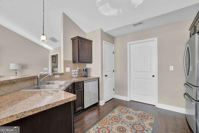 kitchen with hanging light fixtures, sink, dark hardwood / wood-style flooring, appliances with stainless steel finishes, and dark brown cabinetry