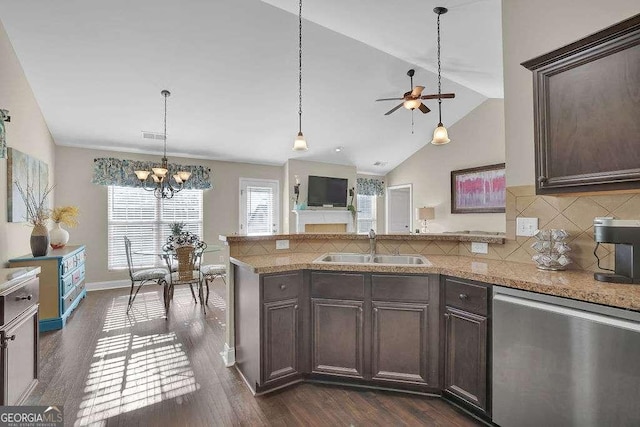 kitchen featuring sink, dishwasher, tasteful backsplash, dark brown cabinets, and dark hardwood / wood-style floors