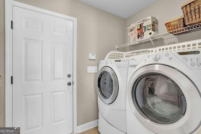 laundry area with independent washer and dryer